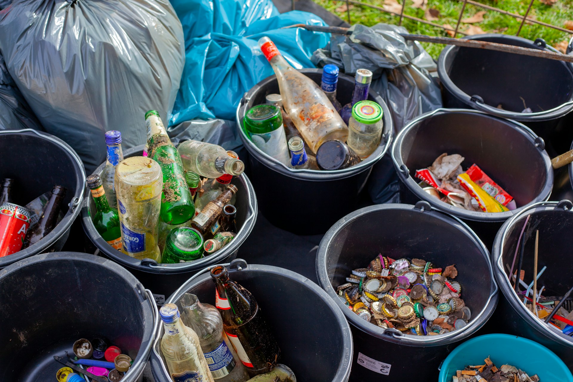 assorted plastic bottles in black plastic bucket