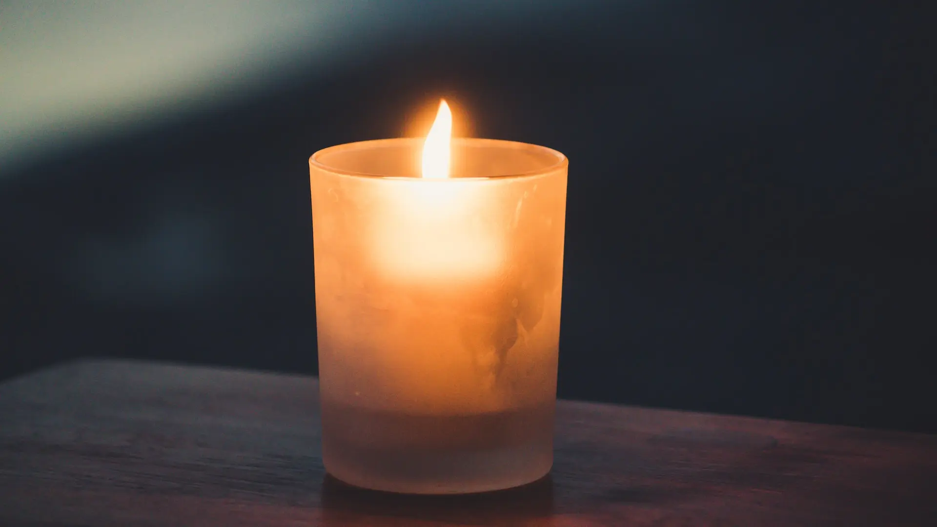 tea light on brown surface