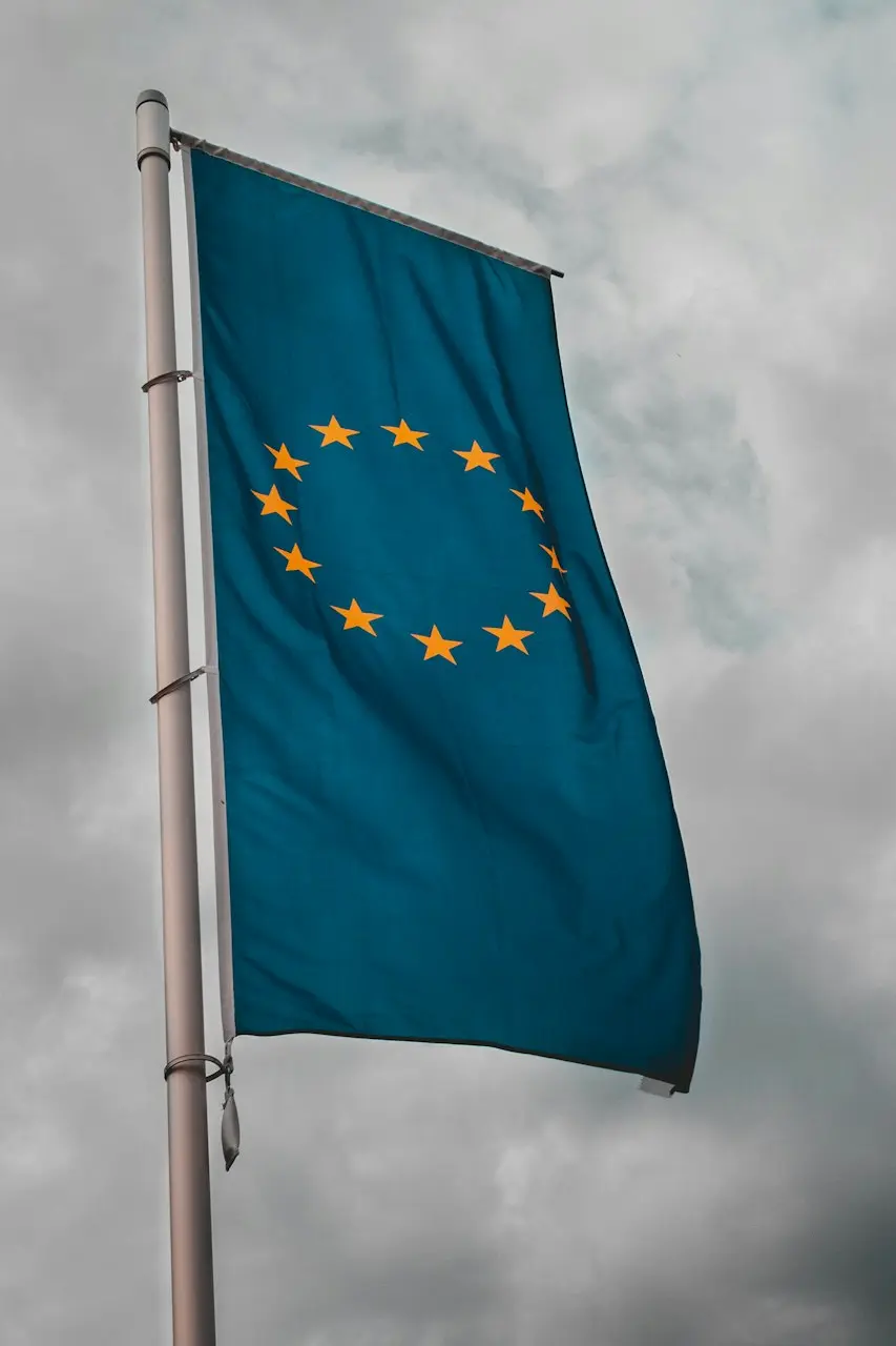 teal flag under cloudy sky