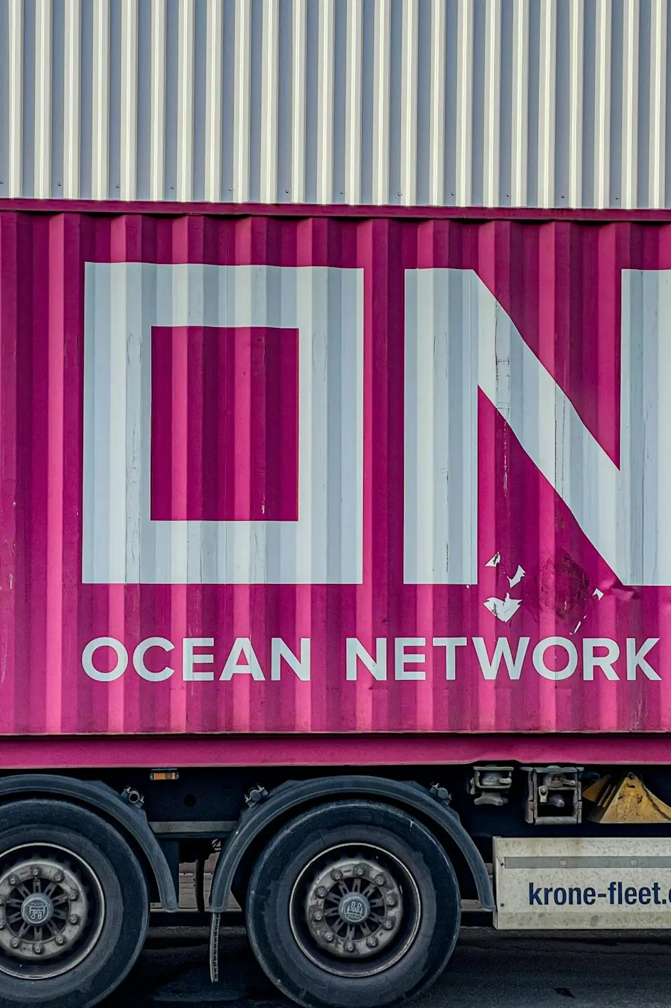 a pink truck with the word ocean network express painted on it