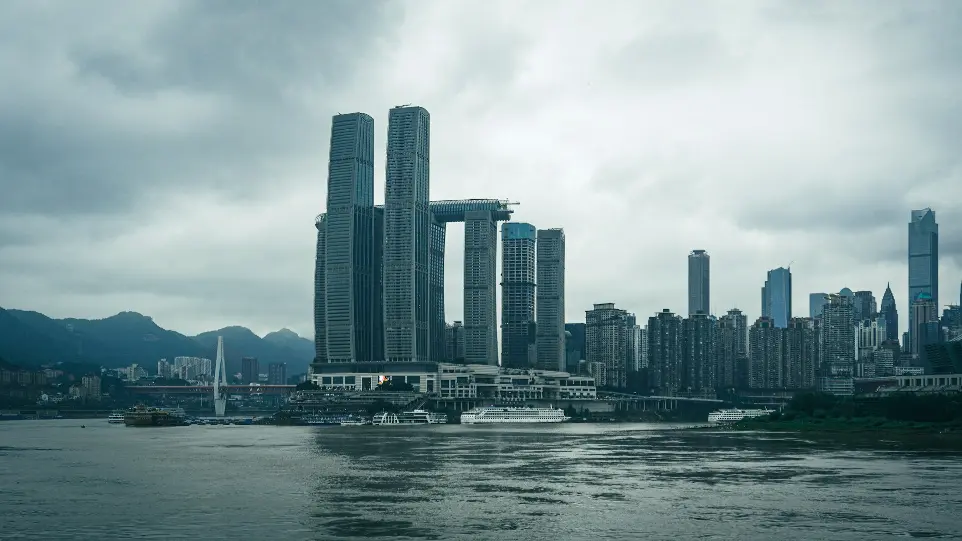 city skyline under cloudy sky during daytime